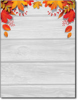 fall leaves over table stationery letterhead paper sheets